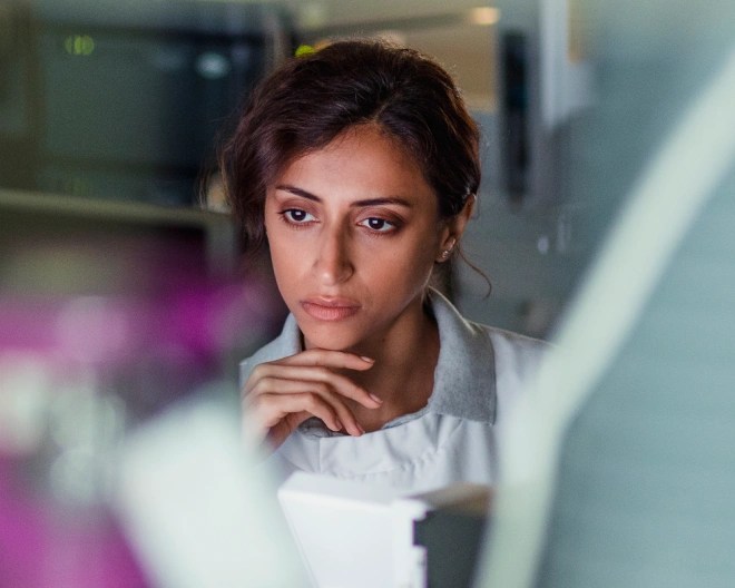 woman doctor looking at a computer